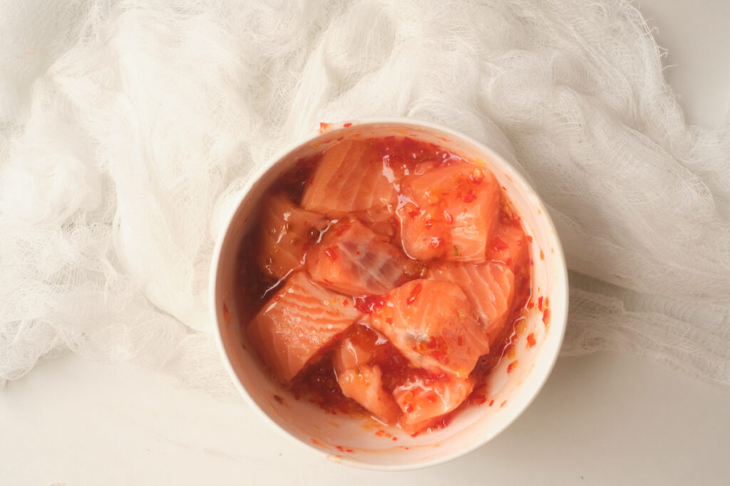 Seasoned salmon cubes in a bowl