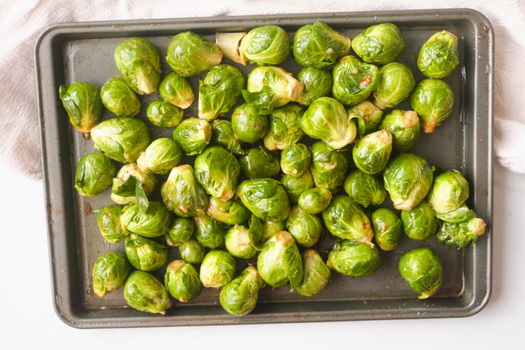 brussel sprouts on a baking sheet before being roasted